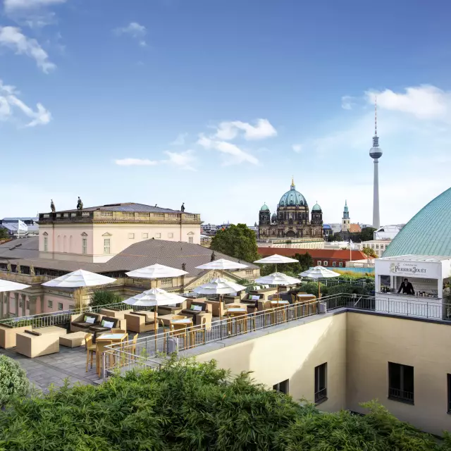 Roof terrace of the Hotel de Rome Berlin with view at Berlin TV Tower