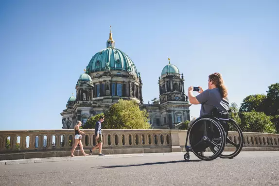 Blog Berlin Meetings, holding a meeting without barriers in Berlin, wheelchair users in front of the Berlin Cathedral