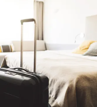 Beautiful modern hotel room and suitcase
