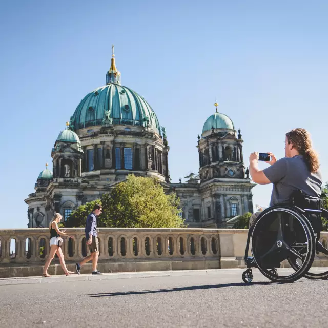 Blog Berlin Meetings, holding a meeting without barriers in Berlin, wheelchair users in front of the Berlin Cathedral