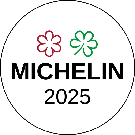 Michelin-Logo mit roter und grüner Blume sowie der Jahreszahl 2025