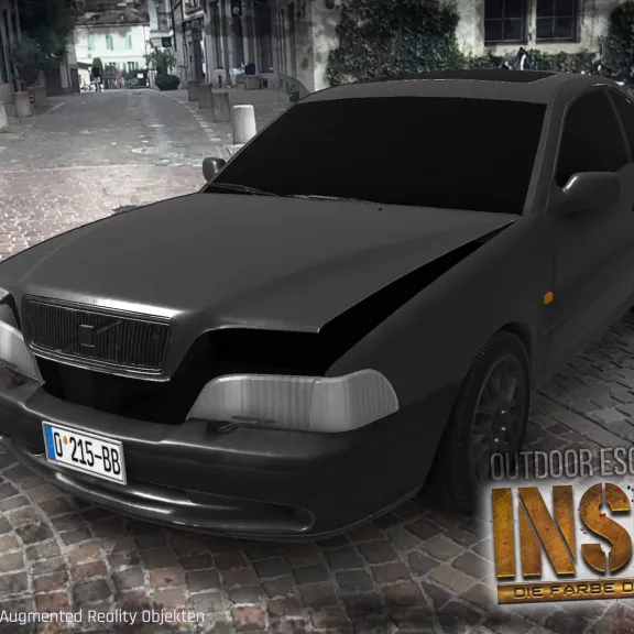 Augmented Reality: ein schwarzes virtuelles Auto wird auf einer echten Straße sichtbar