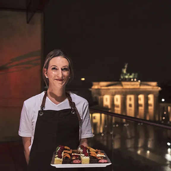 waitress serving sweet fingerfood