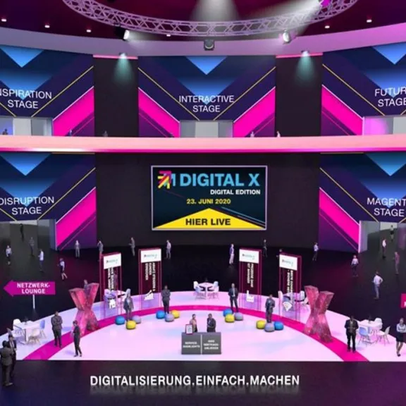 Virtuelle Messehalle mit bunten Ständen und DIGITAL X Logo auf zentraler Leinwand.