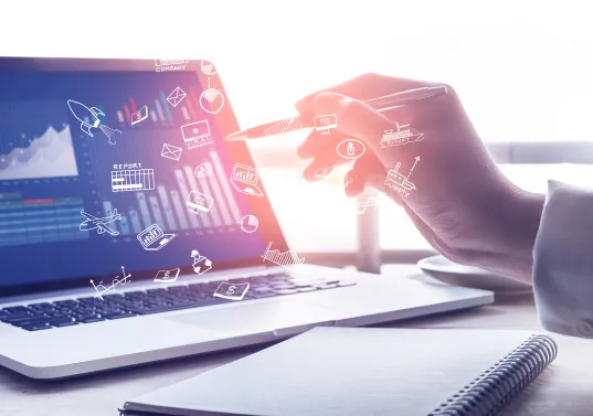 Digital analysis: Hand interacts with virtual symbols via laptop with diagrams and data.
