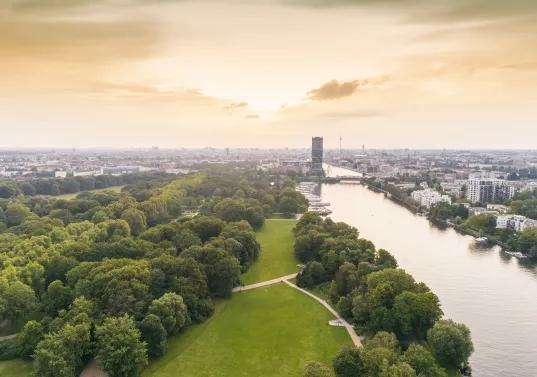 Aerial view of Berlin's Treptower Park with the city skyline in the background