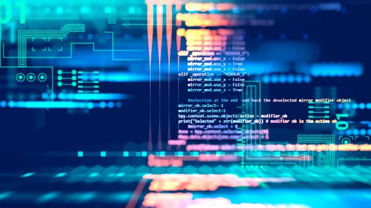 Computer code on screen with colorful blue and orange data patterns.