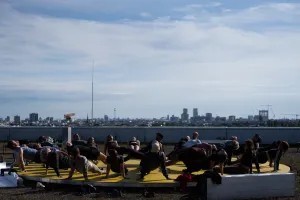 People relaxing on deckchairs and enjoying the view of the Berlin skyline