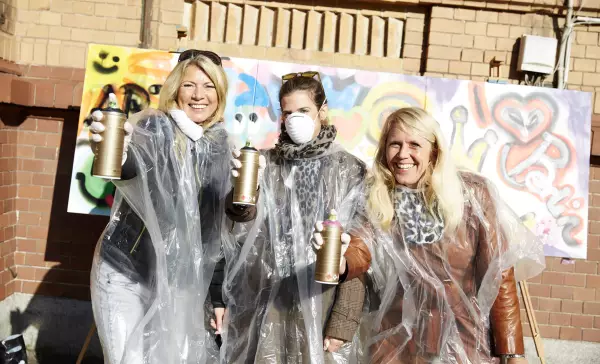 Services Berlin Convnetion Office Incentives in Berlin - Graffiti Workshop, three participants with spray can in hand