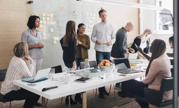 Multicultural team meeting in a bright office with open discussion
