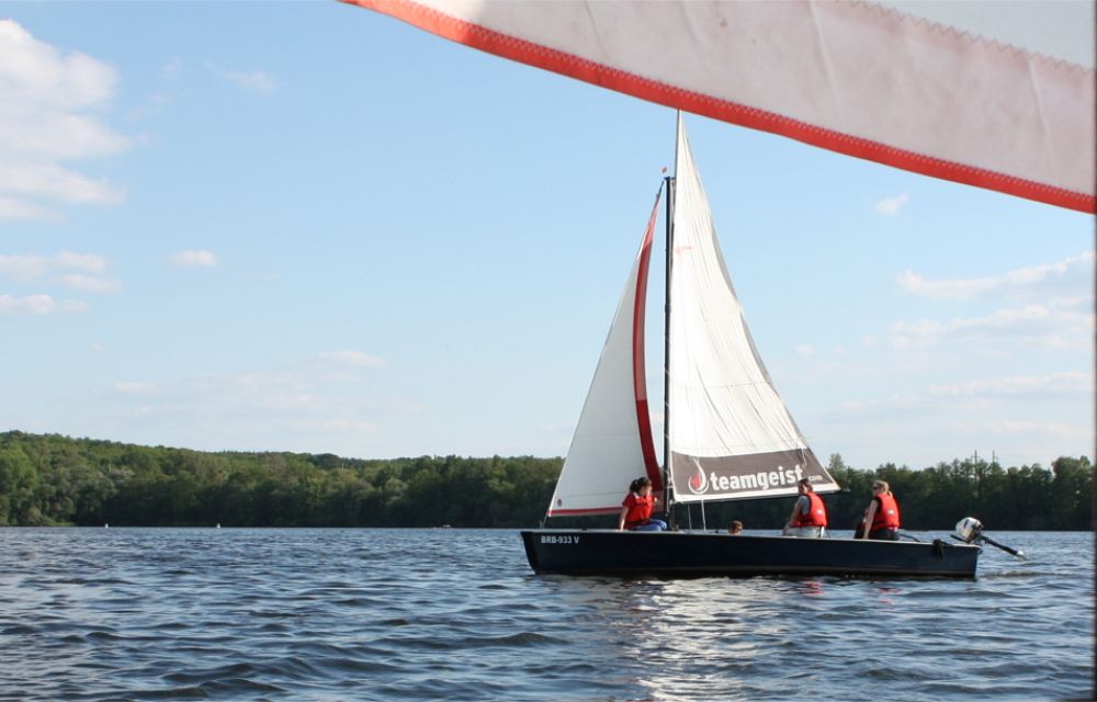 Sailboat sails across the lake