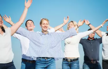 Meeting Guide Berlin Team spirit team during relaxation exercises in the sun
