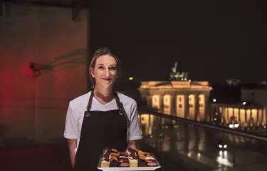 waitress serving sweet fingerfood