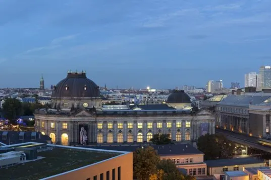 Berlin city skyline at dusk with the TV Tower and historic buildings.
