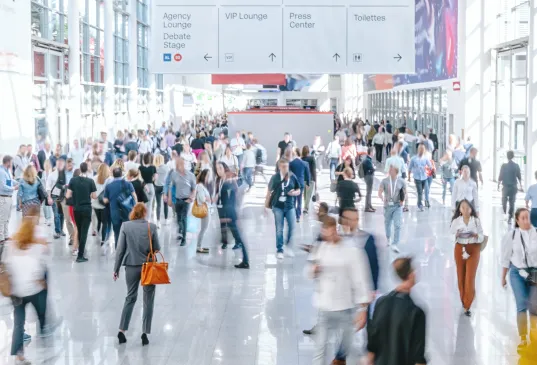 Trade fair visitors in the foyer of a large exhibition hall at the Frankfurt am Main exhibition grounds
