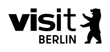 Logo mit Schriftzug „visit Berlin“ und stilisiertem Berliner Bären