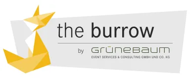 Logo mit Origami-Fuchs und Text "the burrow by GRÜNEBAUM" auf grauem Hintergrund