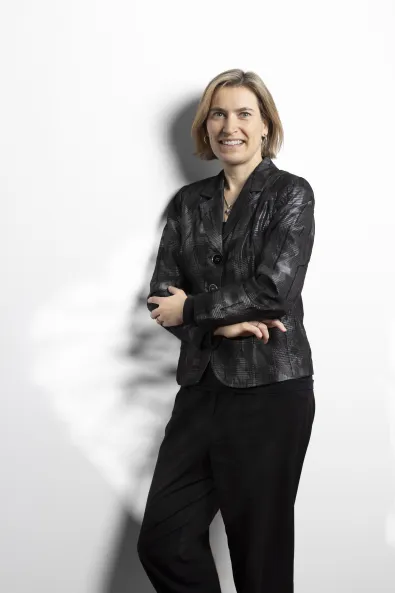 Photo of a smiling woman wearing a black top, Katja Sukale, Senior Marketing Manager for Conventions at the Berlin Convention Office