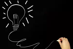 Hand drawing on a black board Hand drawing of an illumination on a black board