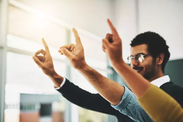 People raise their hands for interactive exchange and to ask questions