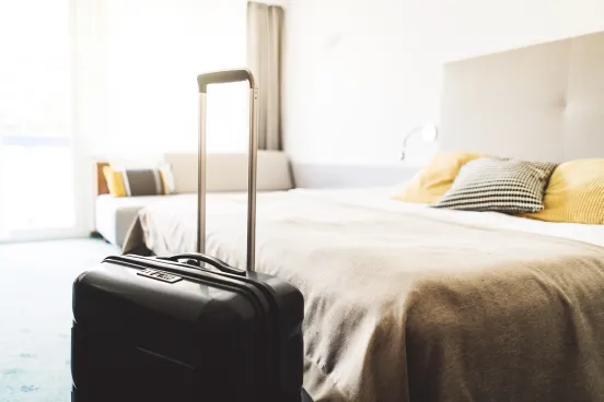 Beautiful modern hotel room and suitcase