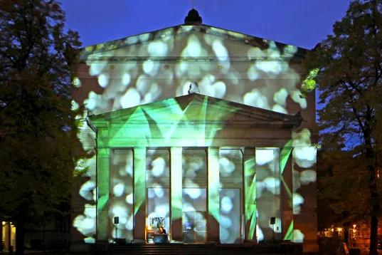 A church is illuminated in vibrant colors during the Festival of Lights in October.