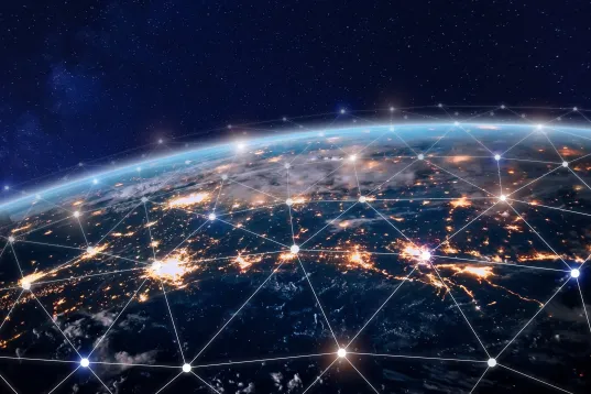 Global digital networking: Bright cities and global data connections on Earth as seen from space.