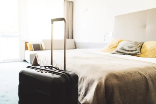 Beautiful modern hotel room and suitcase