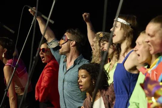 Side view of a singing choir