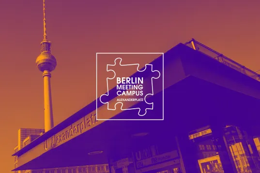 Alexanderplatz underground station entrance with television tower and Berlin Meeting Campus logo